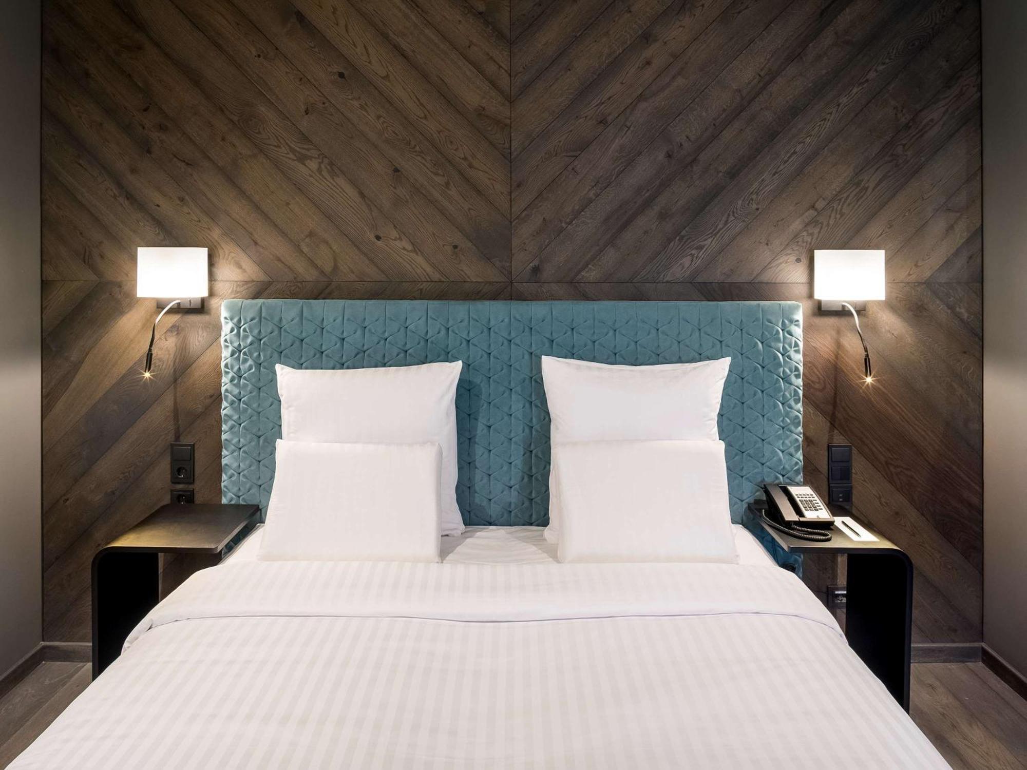 ホテル プルマン リガ オールド タウン エクステリア 写真 A bedroom at the hotel